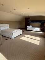 Hidden Waterfront Luxury Oasis With 9-acre Pond 5 Bedroom Home by RedA