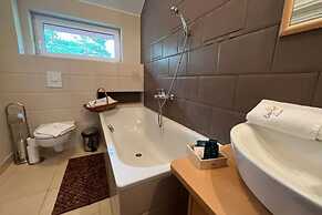 Holiday House With Sauna and Garden, Pobierowo