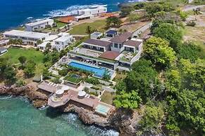 Gorgeous Beach House Perched Right Over the Ocean