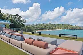 Gorgeous Beach House Perched Right Over the Ocean
