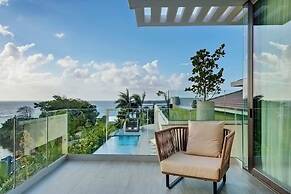 Gorgeous Beach House Perched Right Over the Ocean