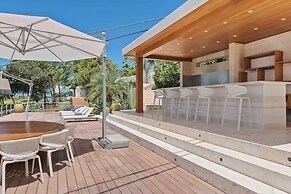 Gorgeous Beach House Perched Right Over the Ocean