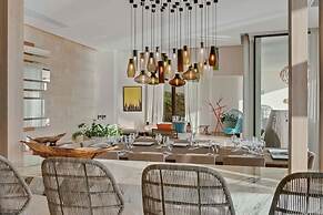 Gorgeous Beach House Perched Right Over the Ocean