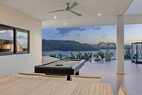 Gorgeous Beach House Perched Right Over the Ocean