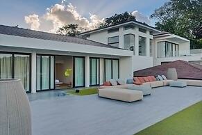 Gorgeous Beach House Perched Right Over the Ocean