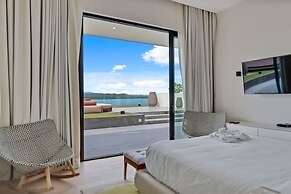 Gorgeous Beach House Perched Right Over the Ocean