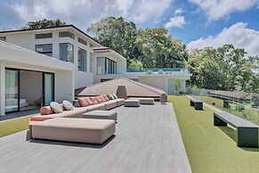 Gorgeous Beach House Perched Right Over the Ocean