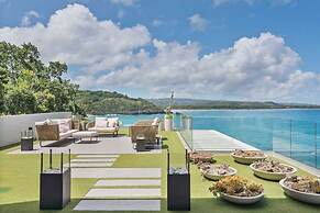 Gorgeous Beach House Perched Right Over the Ocean