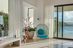 Gorgeous Beach House Perched Right Over the Ocean