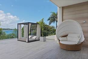 Gorgeous Beach House Perched Right Over the Ocean