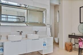 Gorgeous Beach House Perched Right Over the Ocean