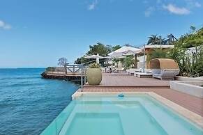 Gorgeous Beach House Perched Right Over the Ocean
