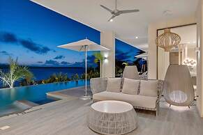 Gorgeous Beach House Perched Right Over the Ocean