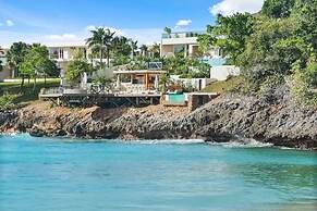 Gorgeous Beach House Perched Right Over the Ocean