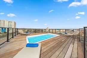 Modern Corner Unit Pool Steps From Palm Beach