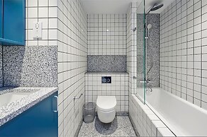 Upscale Two-bedroom Home in a Brutalist Setting