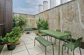 Upscale Two-bedroom Home in a Brutalist Setting