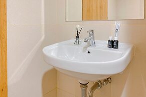 Restful and Homey Studio at Gateway Park LRT City Bekasi Apartment