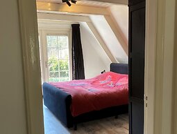 A Detached Bungalow With Outdoor Fireplace, Covered Terrace and Pond i