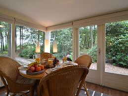 A Detached Bungalow With Outdoor Fireplace, Covered Terrace and Pond i