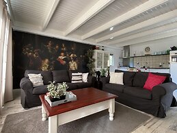 A Detached Bungalow With Outdoor Fireplace, Covered Terrace and Pond i