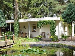 A Detached Bungalow With Outdoor Fireplace, Covered Terrace and Pond i