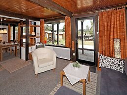 Wooden Chalet With Terrace Near a Swimming Lake