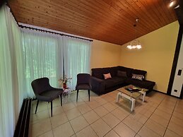 Wooden Bungalow With a Terrace, in a Wooded Area