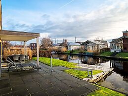 Bungalow With an Outdoor Fireplace by Water