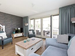 Bungalow With an Outdoor Fireplace by Water