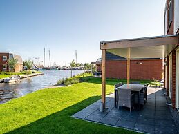 Bungalow With an Outdoor Fireplace by Water