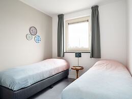 Bungalow With an Outdoor Fireplace by Water