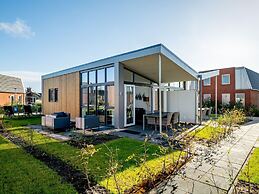 Bungalow With an Outdoor Fireplace by Water