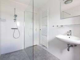 Bungalow With an Outdoor Fireplace by Water