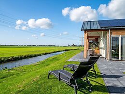 Bungalow With an Outdoor Fireplace by Water