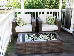 Bungalow With an Outdoor Fireplace by Water