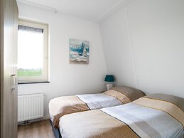 Bungalow With an Outdoor Fireplace by Water