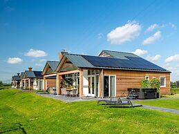 Bungalow With an Outdoor Fireplace by Water