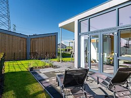 Bungalow With an Outdoor Fireplace by Water