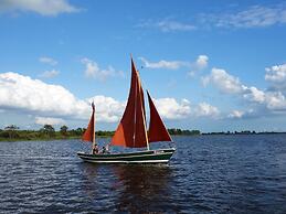 Bungalow With an Outdoor Fireplace by Water