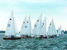 Bungalow With an Outdoor Fireplace by Water