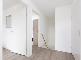 Bungalow With an Outdoor Fireplace by Water