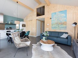 Bungalow With an Outdoor Fireplace by Water