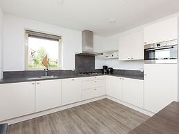 Bungalow With an Outdoor Fireplace by Water