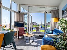 Bungalow With an Outdoor Fireplace by Water