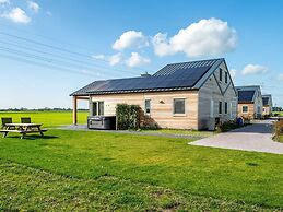 Bungalow With an Outdoor Fireplace by Water
