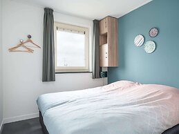 Bungalow With an Outdoor Fireplace by Water