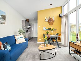 Bungalow With an Outdoor Fireplace by Water