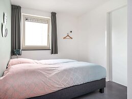 Bungalow With an Outdoor Fireplace by Water