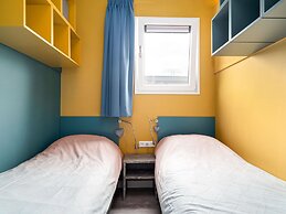 Bungalow With an Outdoor Fireplace by Water